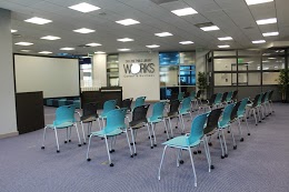 3 rows of 10 chairs, each, facing a projector board